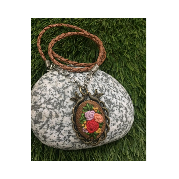 Rose embroidered pendent